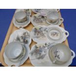 Eight early 20th century Japanese trembleuse-type cups and saucer-plates decorated with varying