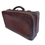 An early 20th century Gladstone-style bag complete with a wide variety of early veterinary