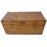 A late 19th/early 20th century brass bound camphor wood chest having reinforced corners, two side