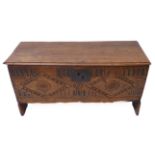 A late 17th century planked elm chest; the lid with moulded edges and probably original hinges above