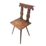 A good and unusual 18th/19th century primitive/vernacular chair (possibly fruitwood); the shaped top