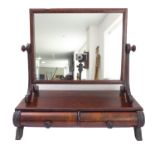 A large late Regency to early Victorian toilet mirror; the rectangular plate above two reeded
