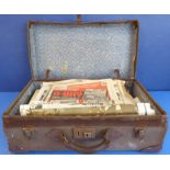 A large number of interesting early collectable newspapers within a mid-20th century suitcase. To