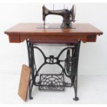 A Naumann treadle sewing machine with iron base; the machine individually numbered 285622,