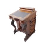 A 19th century figured walnut and marquetry Davenport desk; the stationery cabinet opening to reveal