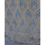 A heavy pair of curtains in a sumptuous blue and gold velvet damask brocade fabric with deep plaited