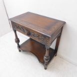 A 19th century style (later) oak side table; the slightly overhanging top with thumbnail moulding