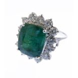 A large emerald ring (11mm x 9mm) surrounded by 12 white diamonds (approx 1.2 carats), size M/N