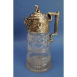 An ornate 19th century claret jug with silver-plated mounts