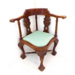 A mahogany corner chair in mid-18th century style (later) - the concave back-rest with gun-barrel