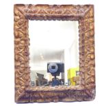 A 19th century wall-hanging looking glass having carved giltwood frame (frame size 30cm x 25cm)