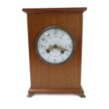 A wooden cased eight-day mantle clock; 19th century earlier movement striking on a bell, with key (