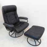 A modern black leather adjustable armchair together with stool