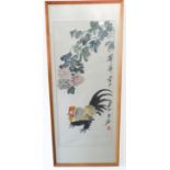 A framed and glazed Chinese watercolour of a rooster beneath hanging peony, signed vertically far