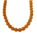 An amber bead necklace (70cm) (untested - the vendor states that this was bought an antiques fair