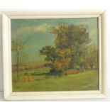 H. BARNETT - an oil on canvas study of cows grazing, signed lower right. The reverse of the canvas