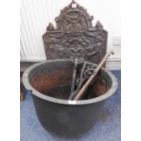 Metalware to include a circular iron copper (54.5cm diameter), an early style cast iron fireback (