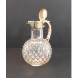 A fine cut-glass silver-mounted claret jug; the glass with hobnail-cut body and star-cut base, the