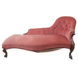 A fine mid-19th century chaise longue; pink velour button-back-upholstered carved walnut, shaped