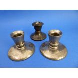 A pair of circa 1900 Tudric pewter candlesticks made for Liberty and one other