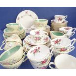 A Crown Staffordshire part tea service and a six-place Susie Cooper tea service. The Susie Cooper