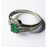 An 18-carat white gold, emerald and diamond ring, ring size O. AMENDED DESCRIPTION - NOT DIAMONDS