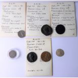 A Holy Roman Empire Byzantine silver coin and five replica Roman coins in 1950s packets