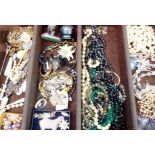 An assortment of costume jewellery and bijouterie to include coin bracelets
