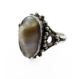 A silver dress ring centrally set with a natural oval mother-of-pearl (ring size O) (presentation