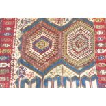 An early / mid 20th century multicolour, tribal flatweave kilim-style carpet (damage and some