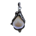 An unusual and large heavy silver mounted pendant set with a large pear-shaped pearl mounted