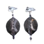 A pair of ethnic style silver earrings modelled in the shape of African shields, decorated both