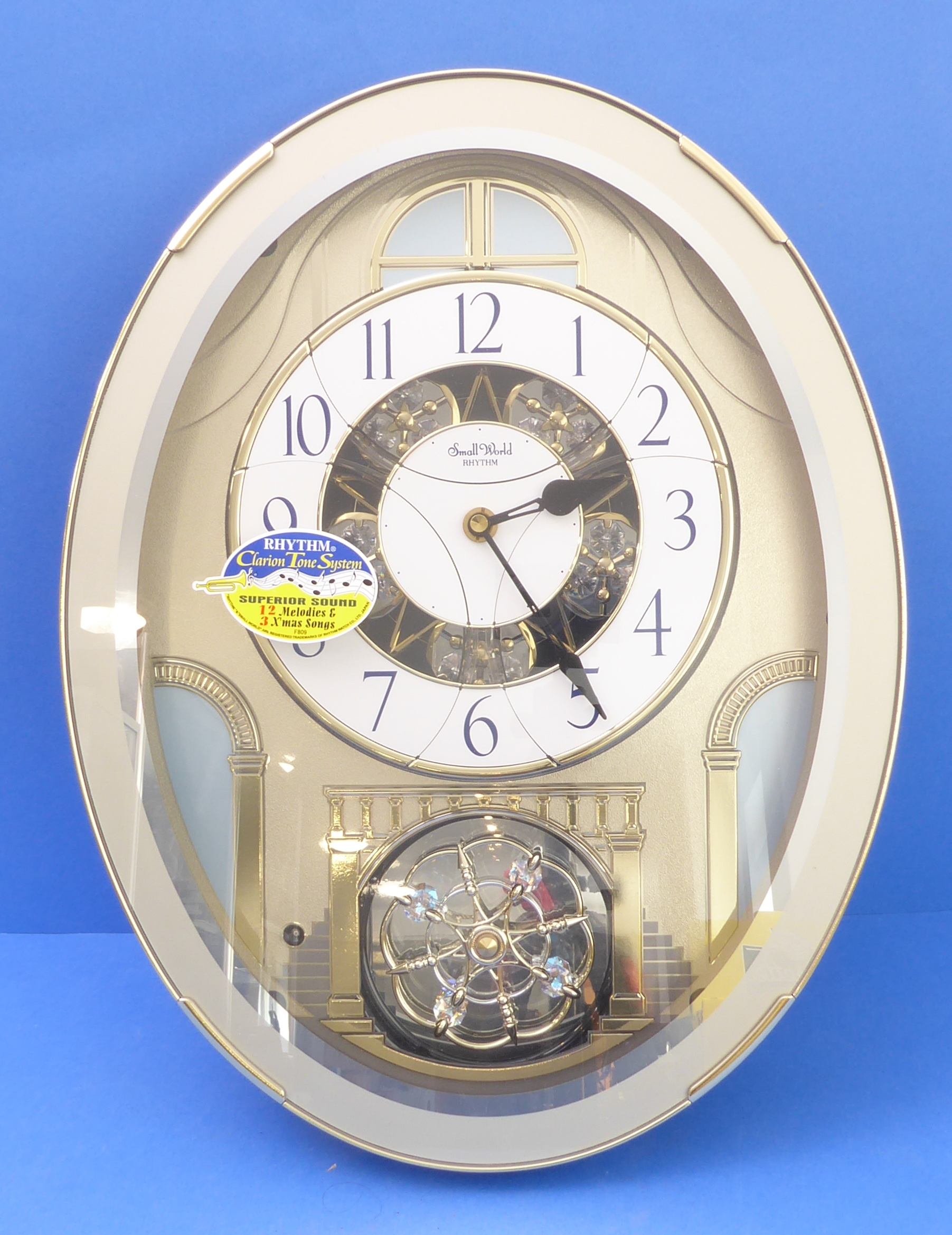 A boxed and unused 'Small World Rhythm' wall-hanging clock, 'Clarion Tone System' playing 12