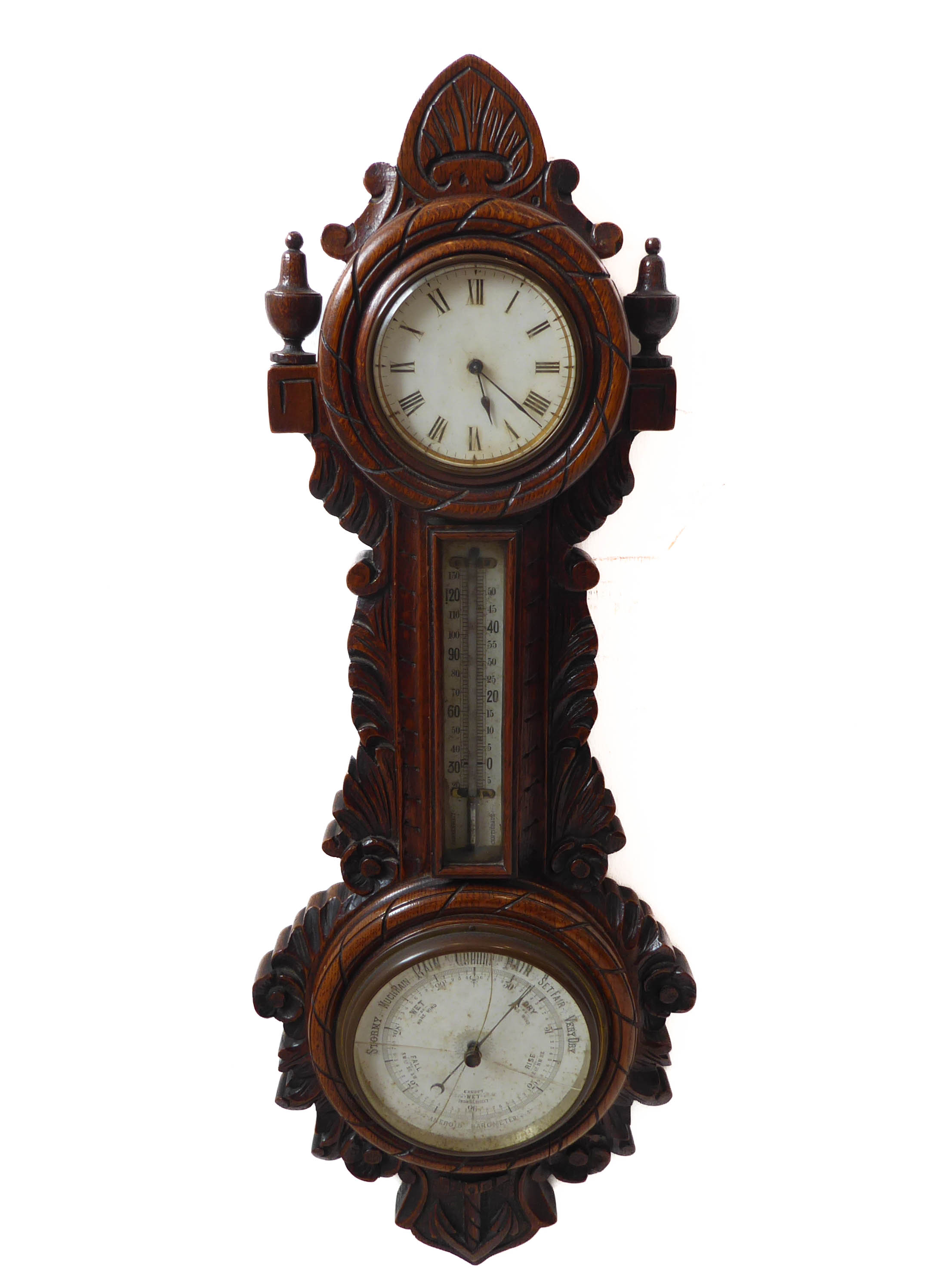 A late 19th century combined clock thermometer and barometer; nautical themed carved oak case with