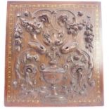 An oak panel; very finely carved with central urn with flowers and leaves issuing and further