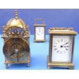 Two very similar 20th century brass carriage clocks each with white enamel dial with Roman numerals,