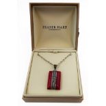 An unusual rectangular polished red hardstone and silver mounted pendant upon a silver neck chain (