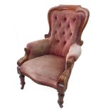 A mid 19th century faded pink button velour upholstered and mahogany show-framed spoonback