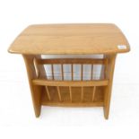 An Ercol light-elm magazine rack (54.5cm wide)