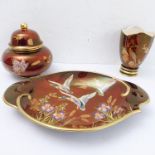 Three pieces of Carlton Ware Rouge-Royale-style ceramics: a two-handled oval dish very delicately