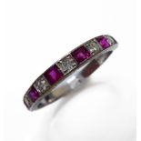 An 18-carat white gold, ruby and diamond half-eternity ring, ring size M/N Condition Report: