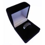 An Italian designer silver ring set with a multitude of hand-cut black stones (ring size N) (boxed)