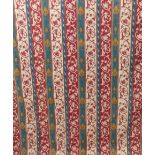 A very large pair of tapestry weave effect curtains in a red and green medieval style pattern,