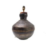 An Eastern-style metal vase, possibly steel, of ovoid form (now fitted for electricity as a