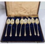 A cased set of eight late 19th century hallmarked silver coffee spoons; gilt bowls, barley-twist