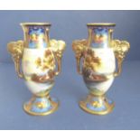 A pair of two-handled Noritake vases; hand decorated and gilded with upper Art Deco style motifs,