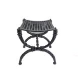 A heavy black-painted cast-iron stool in early 19th century style (modern), with cross-framed
