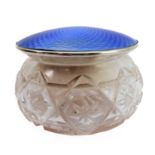 A silver and enamel cut glass powder jar, the lid with blue guilloche enamel hallmarked Birmingham