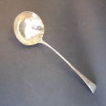 A hallmarked silver Old English pattern ladle: engraved armorial, maker's mark IL (34.5cm, re-