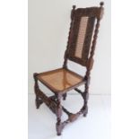 A late 17th century carved walnut side chair: the slightly concave top rail carved with stiff leaves